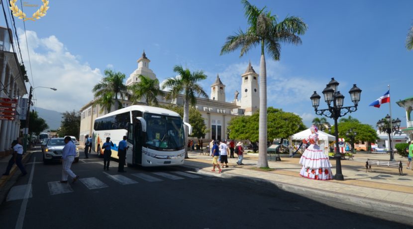 tourist bus arriving at the central park, in Puerto Plata.
