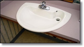 mounted adjustable folding grab bars placed next to the toilet